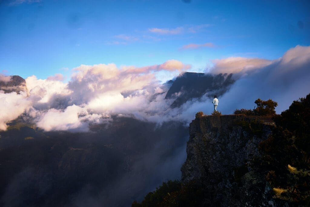 A Person Atop a Mountain